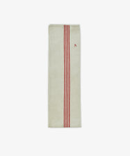 The French Vintage Tea Towel is a rectangular beige linen towel inspired by Provence, featuring three vertical red stripes and a small red embroidered letter A—ideal for adding classic charm to your kitchen.