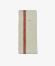 The French Vintage Tea Towel is a beige rectangular cloth napkin with two vertical red stripes and 