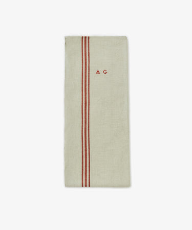 The French Vintage Tea Towel is a beige rectangular cloth napkin with two vertical red stripes and 