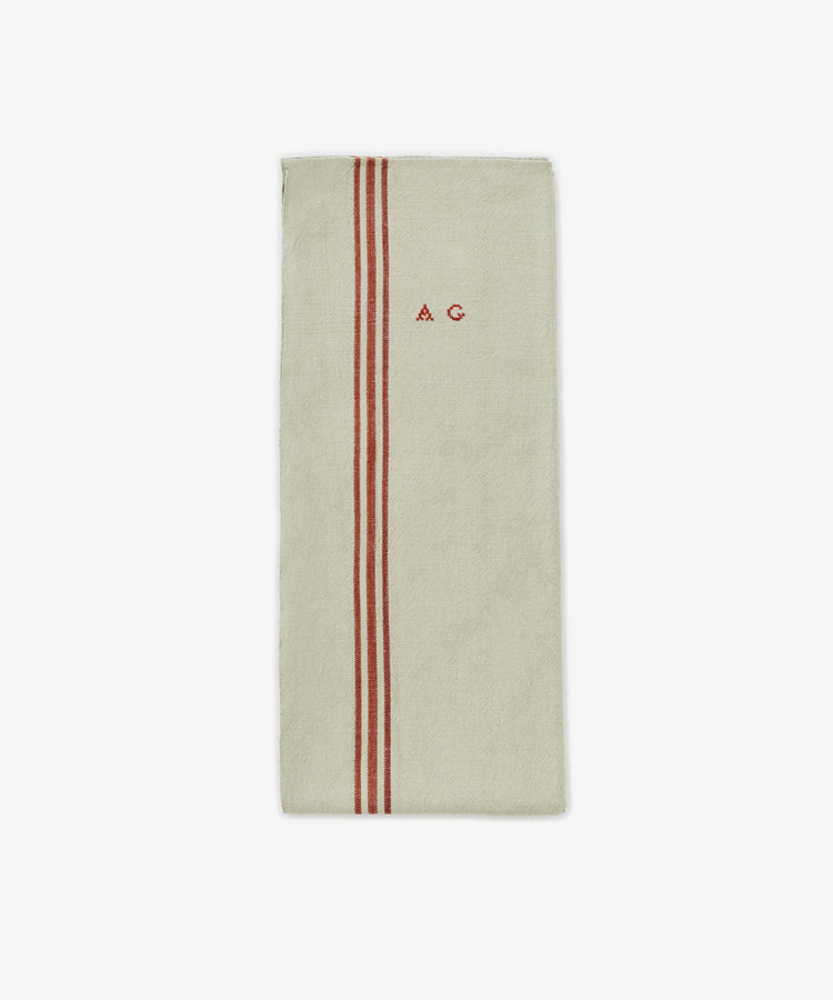 The French Vintage Tea Towel is a beige rectangular cloth napkin with two vertical red stripes and 