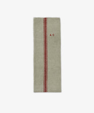 The French Vintage Tea Towel is a rectangular beige linen cloth with a single red vertical stripe and 
