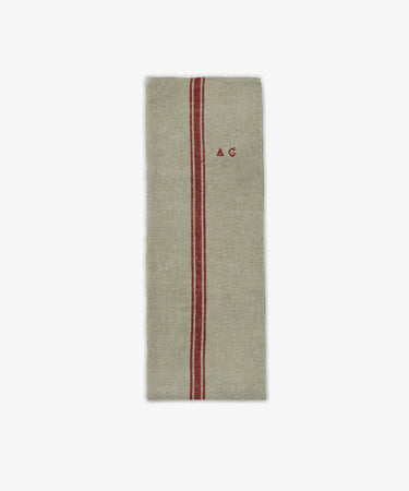 The French Vintage Tea Towel is a rectangular beige linen cloth with a single red vertical stripe and 