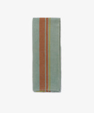 The French Vintage Tea Towel, a folded light blue-green cloth napkin with vertical orange and yellow stripes on one side, is displayed against a white kitchen background.