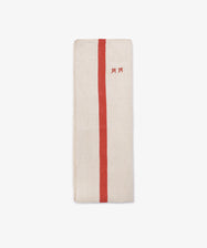 The French Vintage Tea Towel, a folded beige linen napkin with a vertical red stripe and small red embroidered letters, evokes classic vintage style and is displayed on a plain white background.