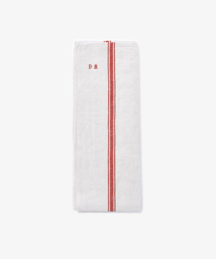 The French Vintage Tea Towel features two parallel red stripes and small red embroidered initials near the top left, styled folded on a plain light background.