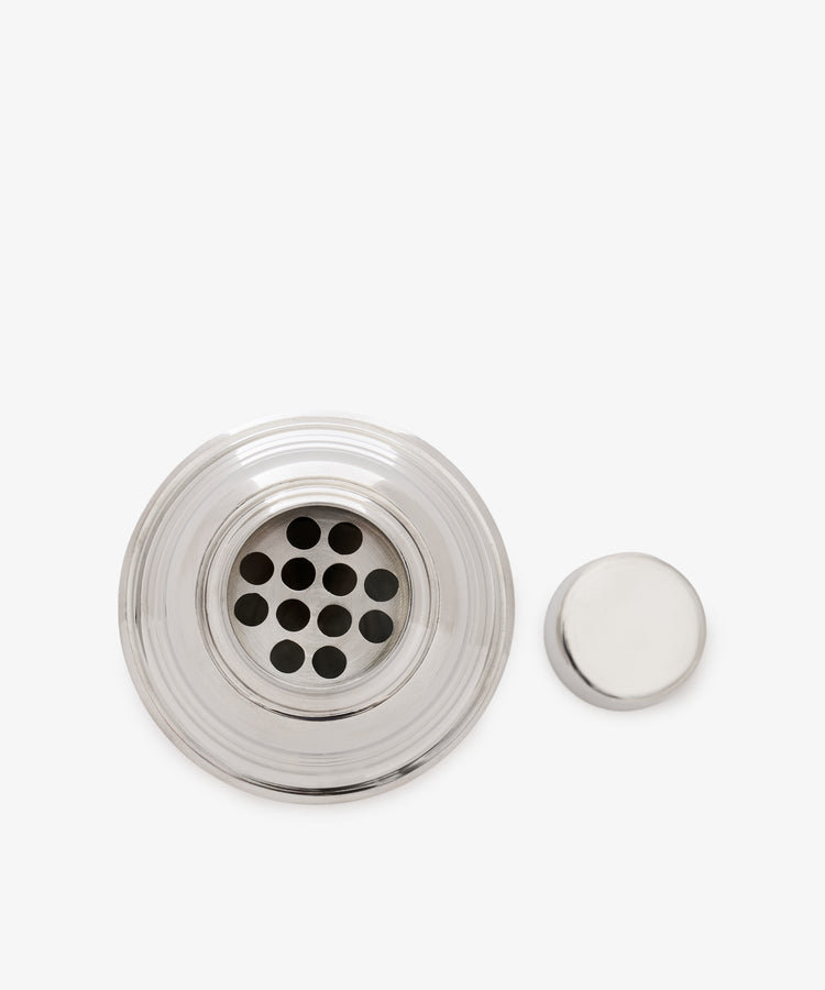 The Oscar Cocktail Shaker, a pewter strainer with a removable round lid and Art Deco accents, is shown on a white background.