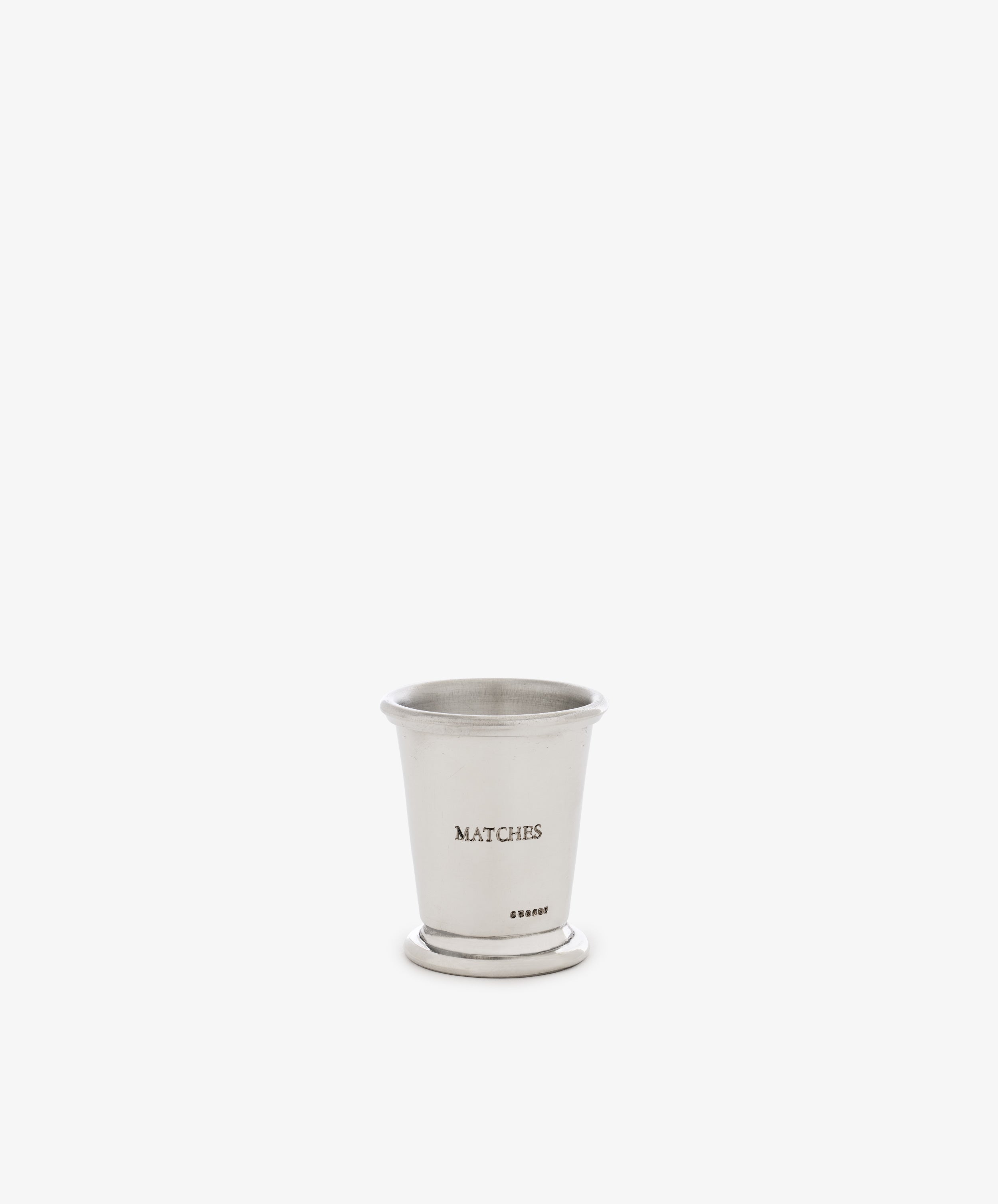 The Jude Match Cup & Striker, a small silver cup engraved with “MATCHES,” is shown against a plain white background.
