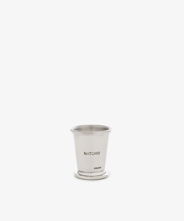 The Jude Match Cup & Striker, a small silver cup engraved with “MATCHES,” is shown against a plain white background.