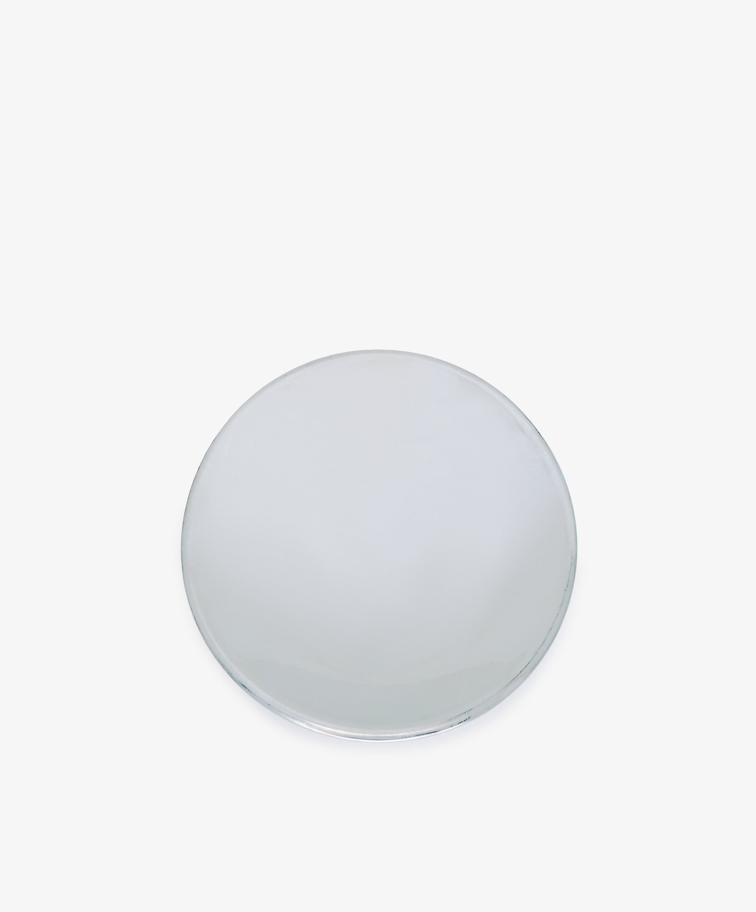 The Elena Bowl, a hand-polished, silver-colored metal vessel with a classic round design, rests on a white background—reflecting timeless elegance.