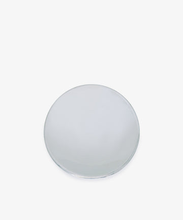 The Elena Bowl, a hand-polished, silver-colored metal vessel with a classic round design, rests on a white background—reflecting timeless elegance.