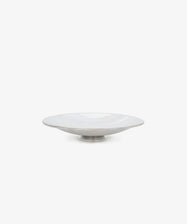 The Elena Bowl is a white ceramic serving vessel with a slightly raised base, hand-polished and shown from the front against a plain white background.