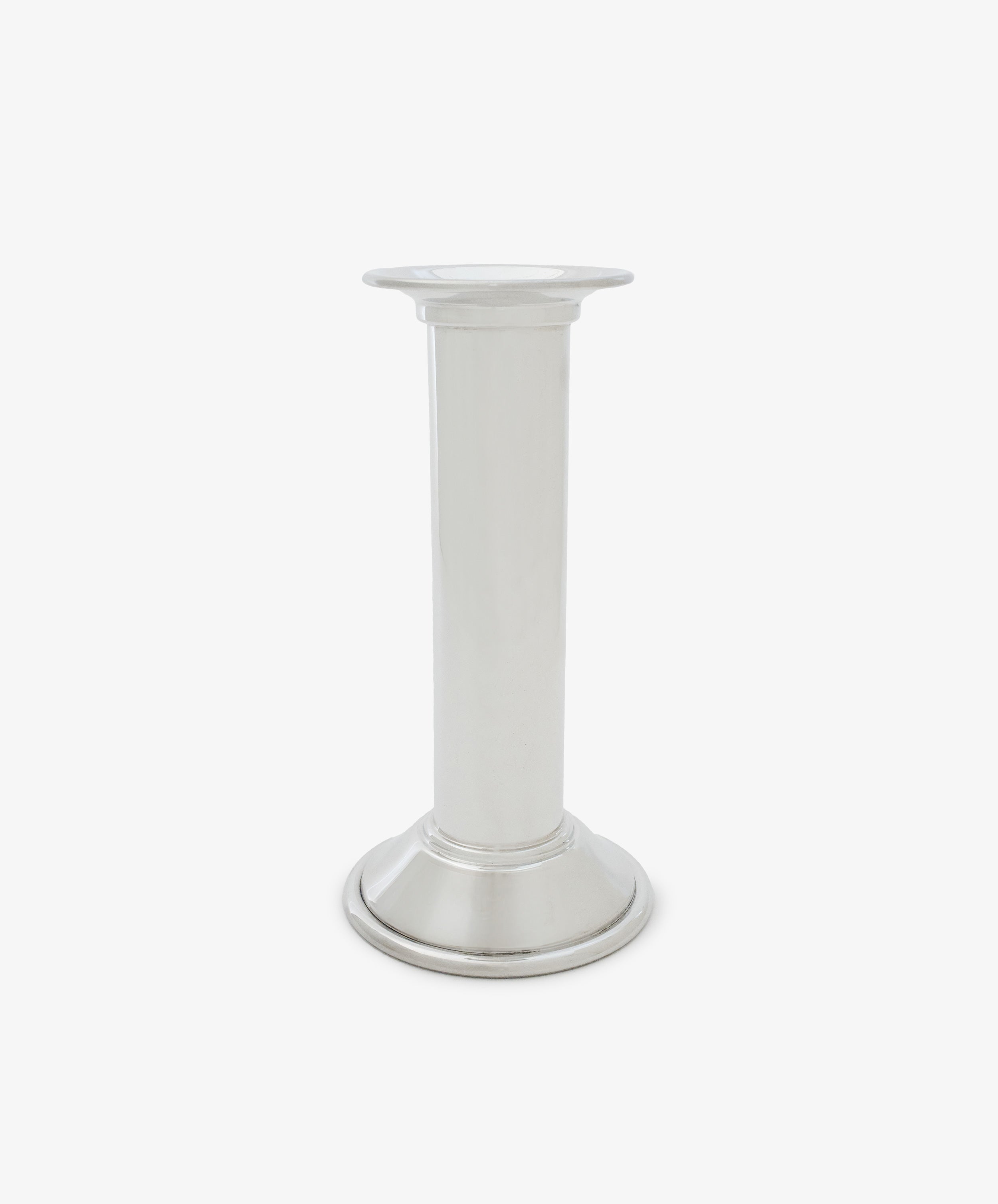 The Dario Candle Holder is a plain silver pewter piece featuring a cylindrical stem and a round base, shown against a white background.