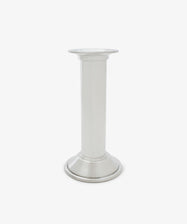 The Dario Candle Holder is a plain silver pewter piece featuring a cylindrical stem and a round base, shown against a white background.