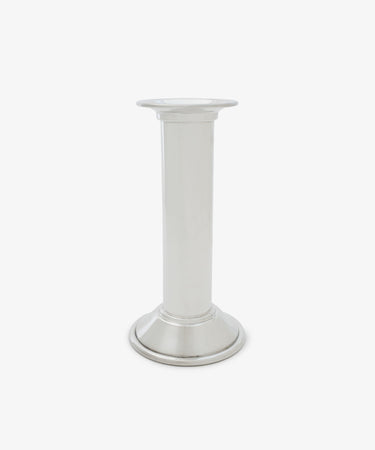 The Dario Candle Holder is a plain silver pewter piece featuring a cylindrical stem and a round base, shown against a white background.