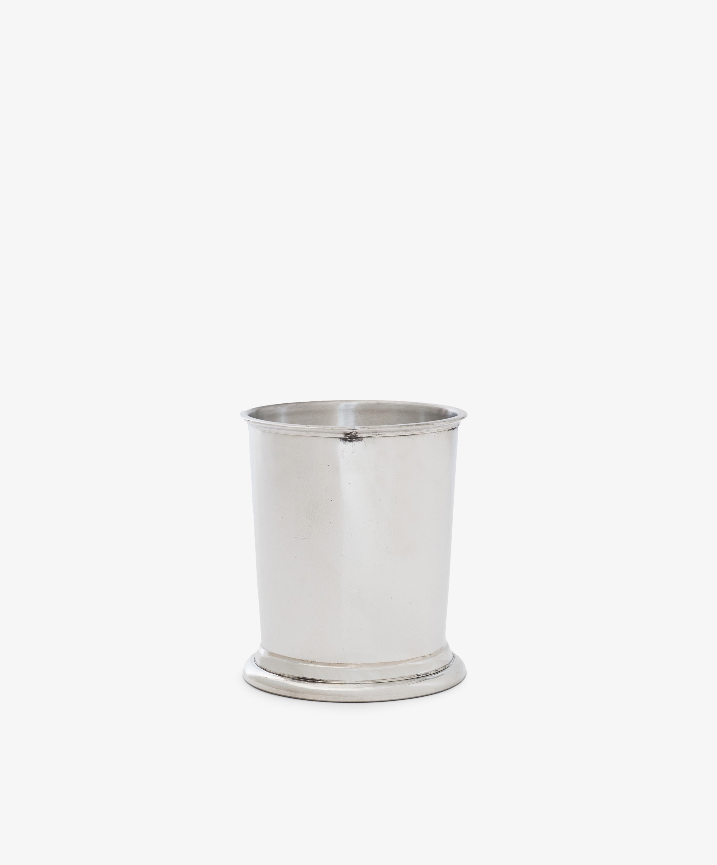 The Serena Pencil Cup, featuring a slightly flared rim and rounded base, sits against a white background, making it a timeless desk essential.