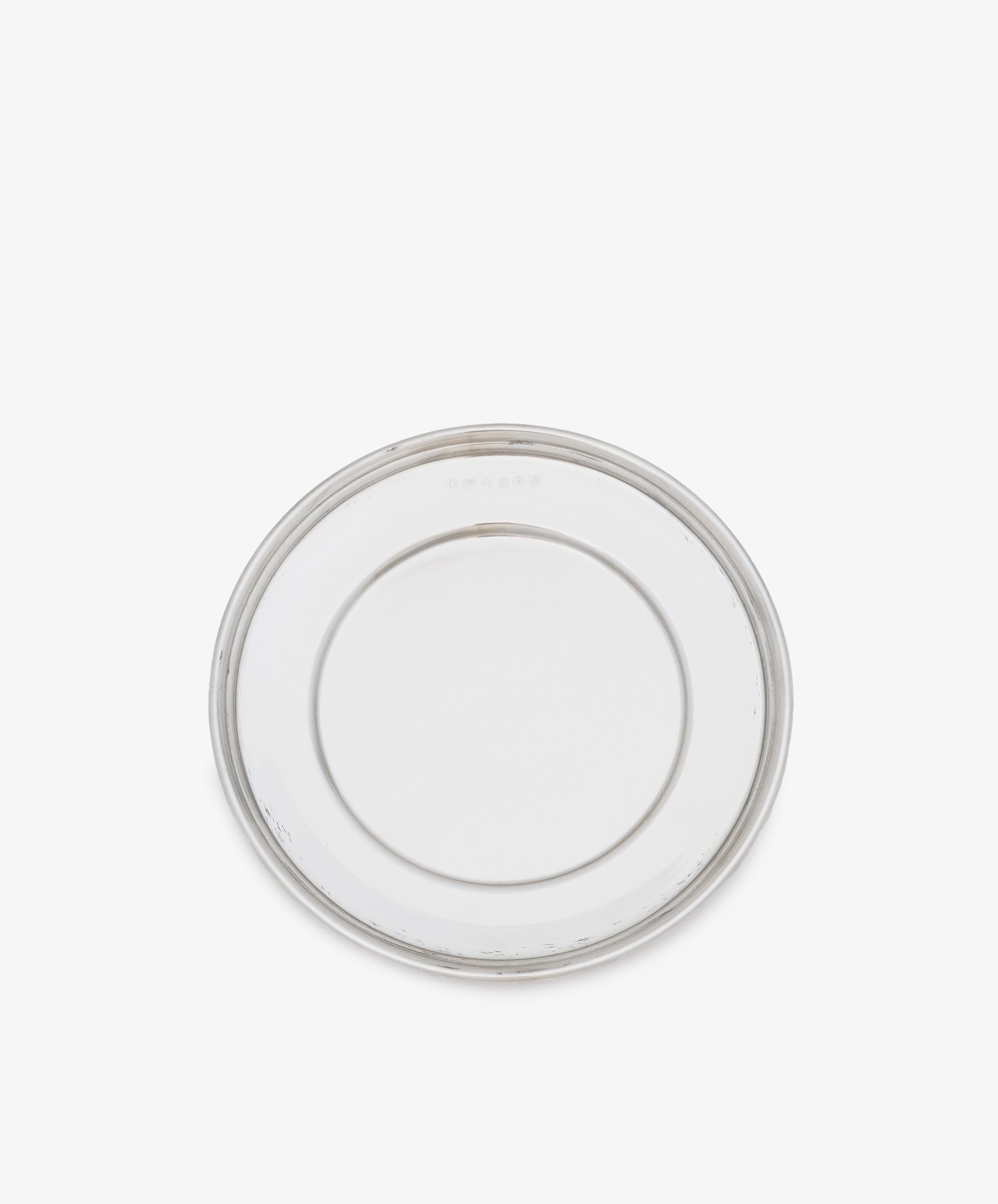 The Greta Small Bread Plate—a clear, round glass plate with a simple design, shown from above on a white background—is a timeless essential for any setting.
