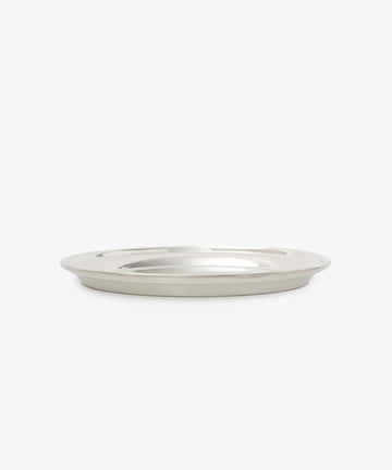 The Sophie Tray, a simple, round, and shallow pewter tray with a minimalist design, is displayed on a white background.