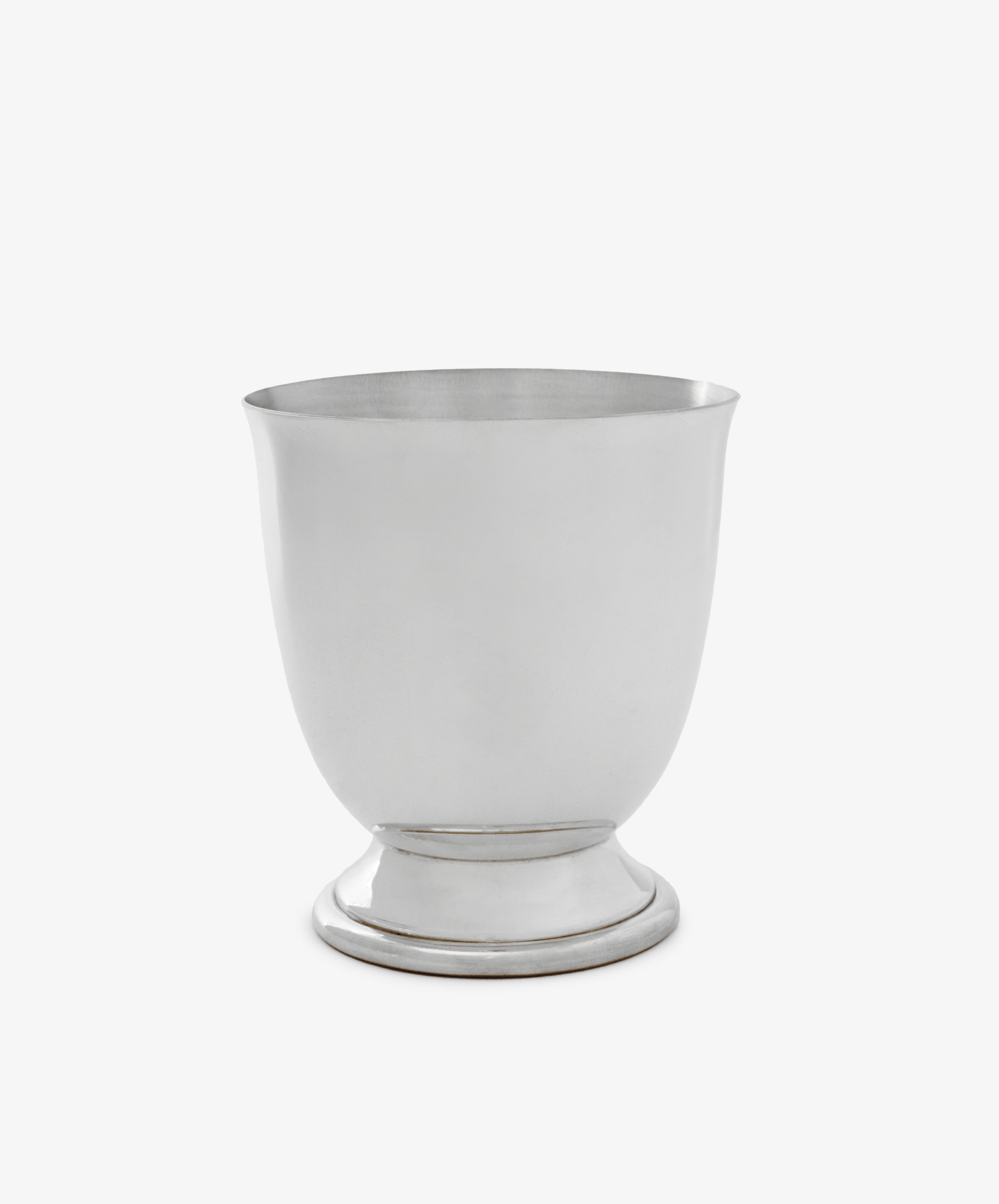 The Lena Pen Pot is a plain, silver-colored metal cup with a rounded body, small pedestal base, and satin finish, shown against a white background.