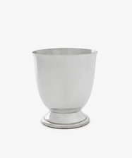 The Lena Pen Pot is a plain, silver-colored metal cup with a rounded body, small pedestal base, and satin finish, shown against a white background.