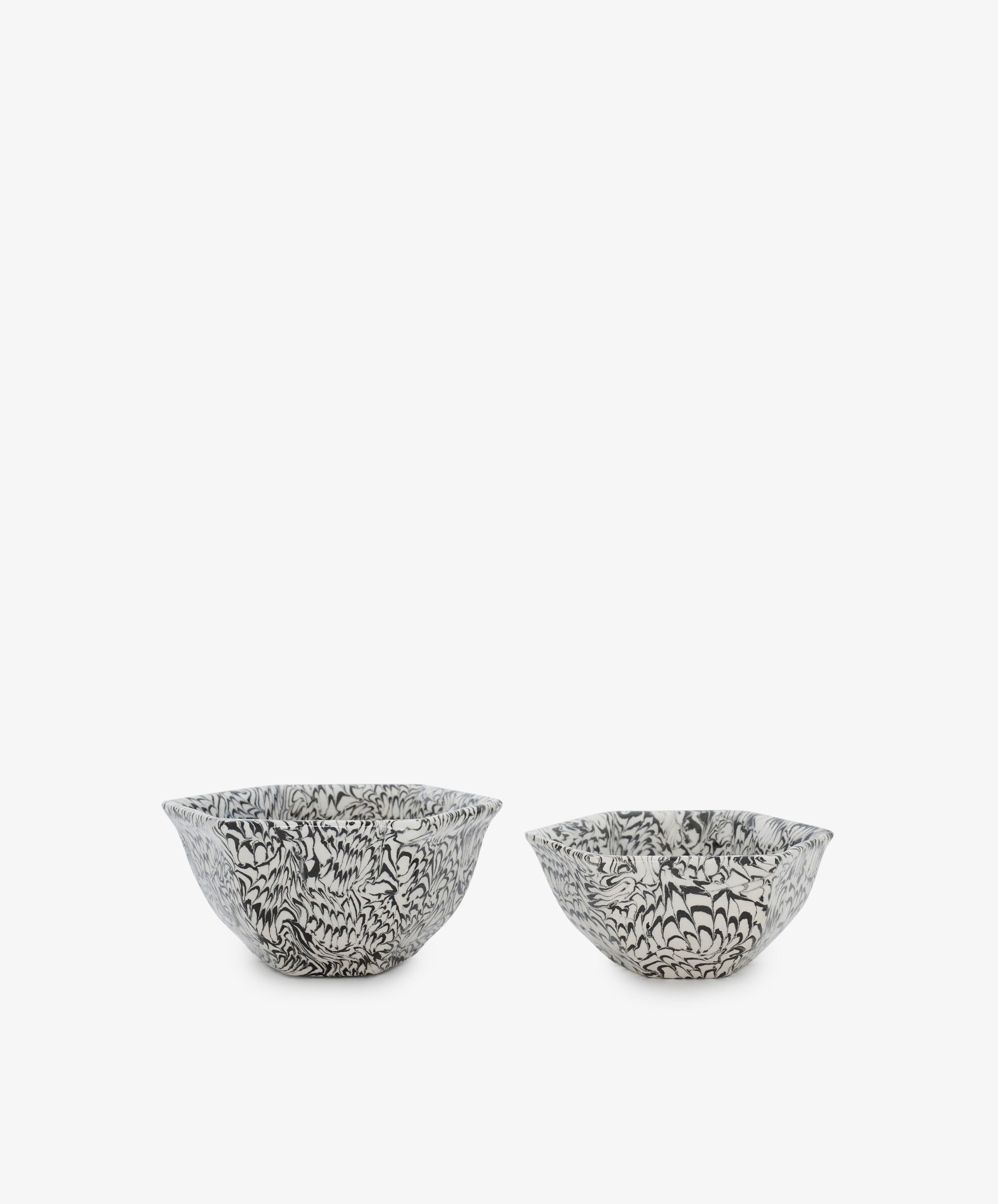 Two Celine Snack Bowls in black and white ceramic with intricate marbled patterns, reminiscent of Aptware, are placed side by side on a plain white background.