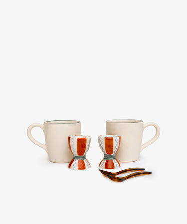 The Breakfast for Two Bundle, featuring two Guido mugs, two Wiggle egg cups, and two Piccolo spoons, is arranged on a plain white background.