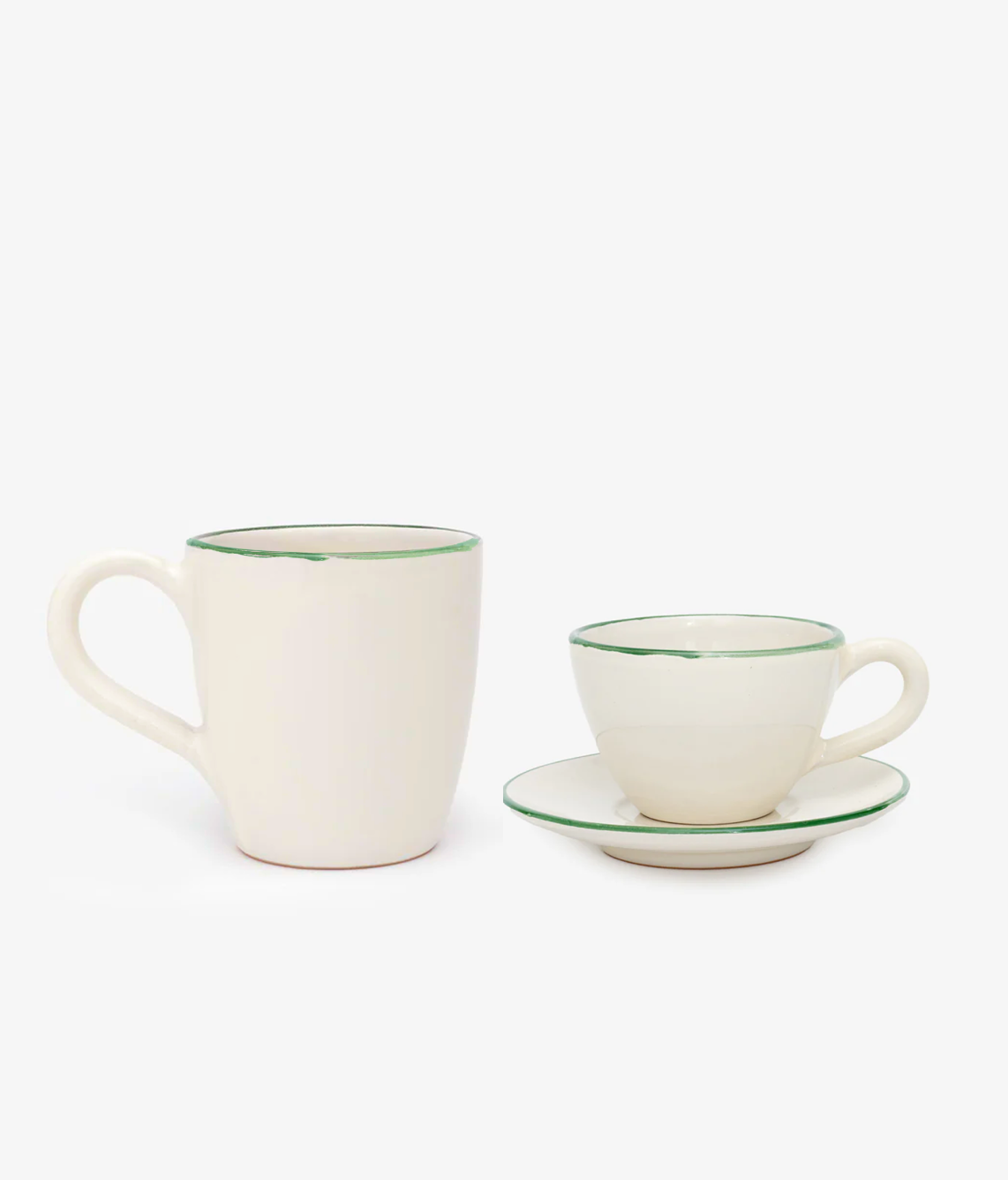 The Guido Coffee Bundle features a white ceramic mug and a matching coffee cup with saucer, each accented by a green rim, creating an elegant breakfast set against a simple background.