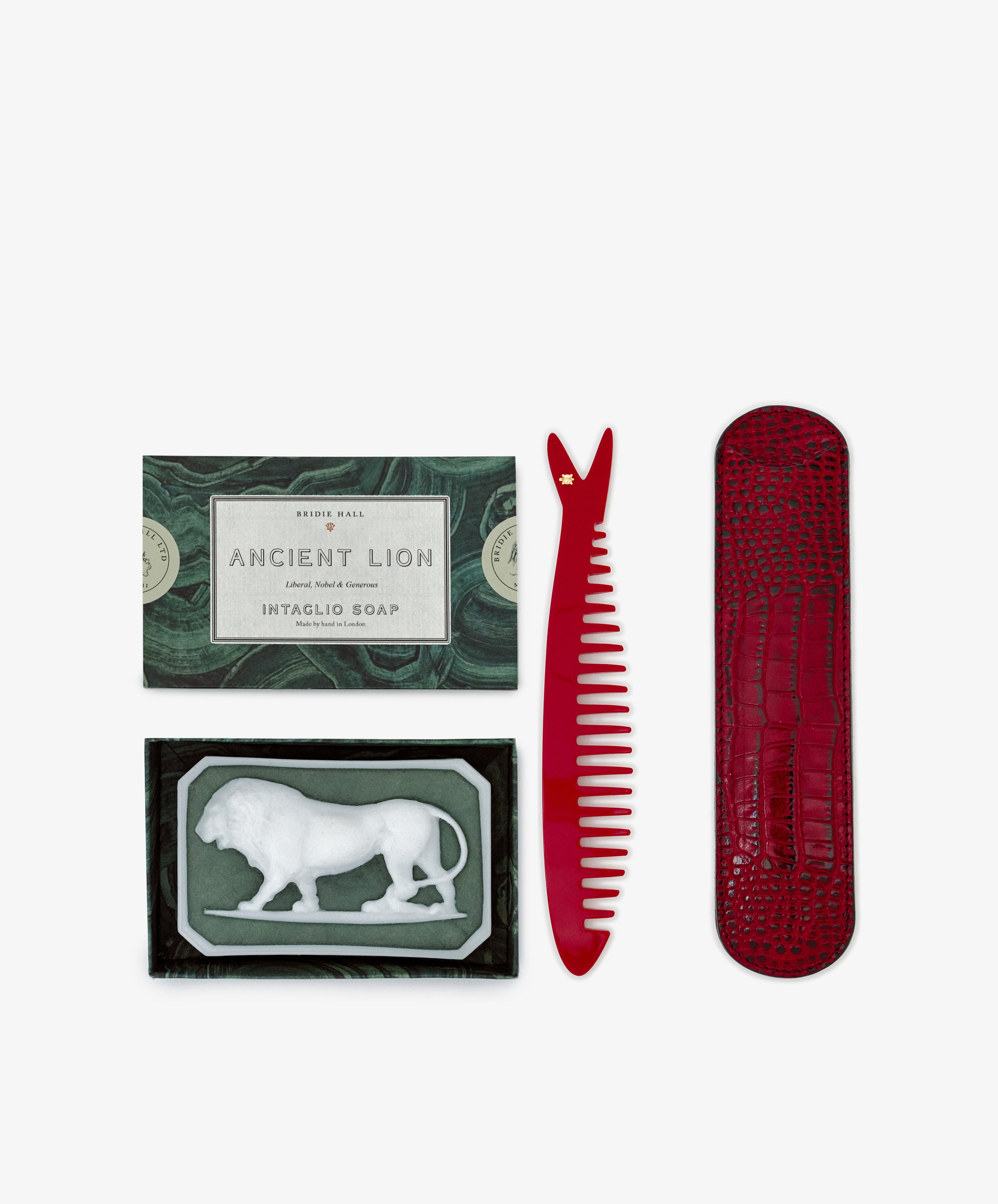 The Clean & Comb Bundle includes Bridie Hall's Ancient Lion soap in a green box with a lion design, plus a Capri sardine comb and matching red case.