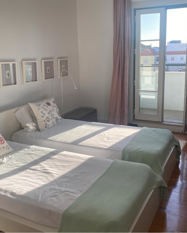 room with two beds and window