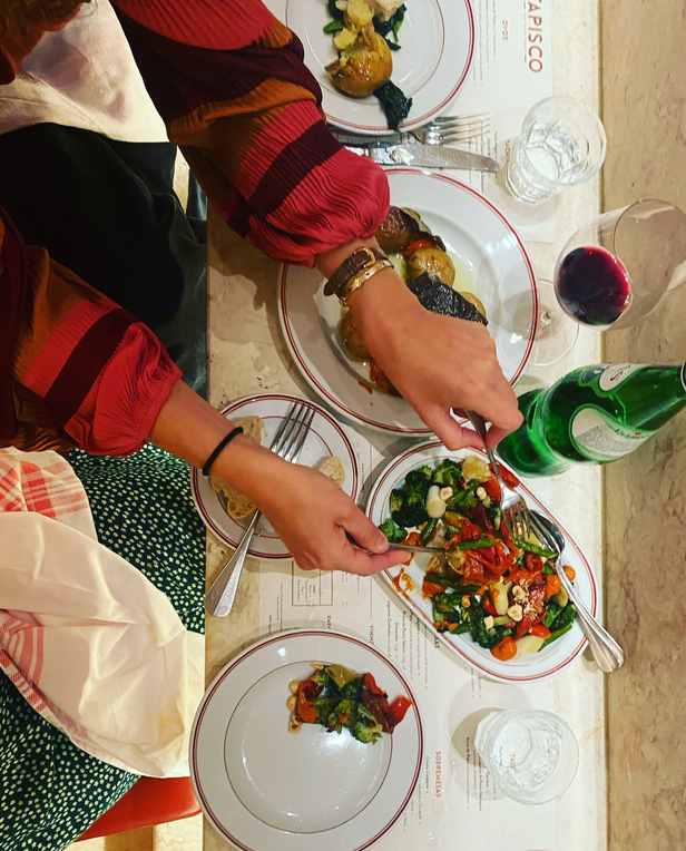 table of food with hands