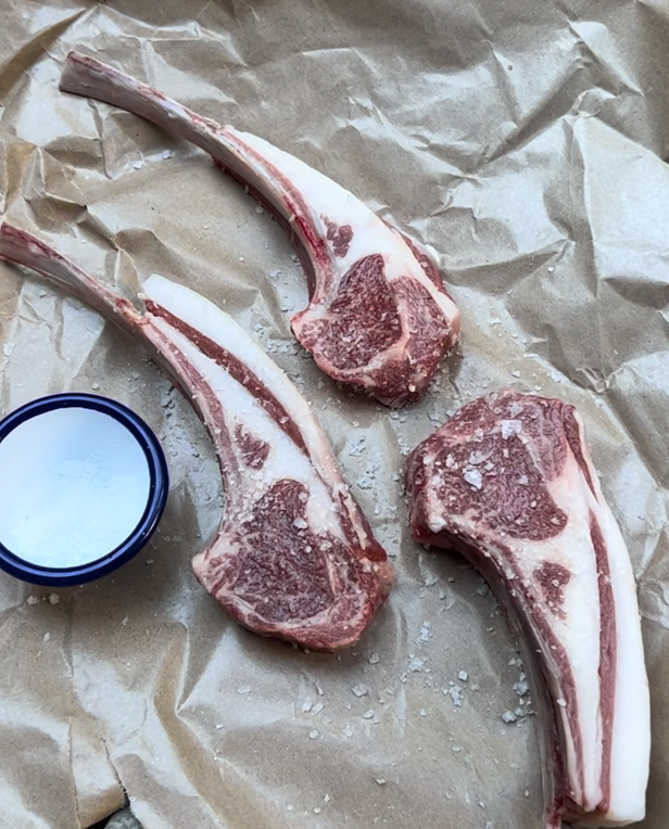 raw meat with small bowl of sea salt