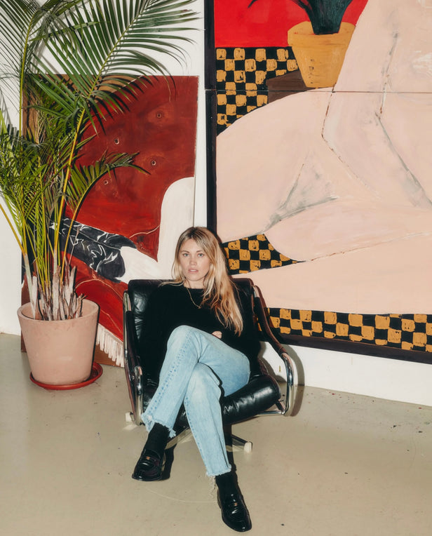 woman with blond hair sitting