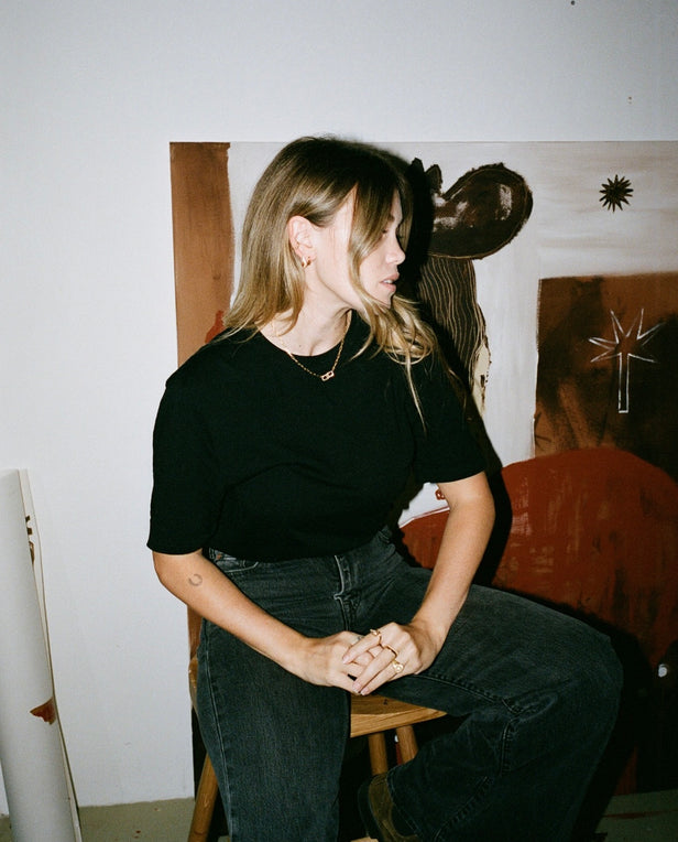 woman with blond hair sitting