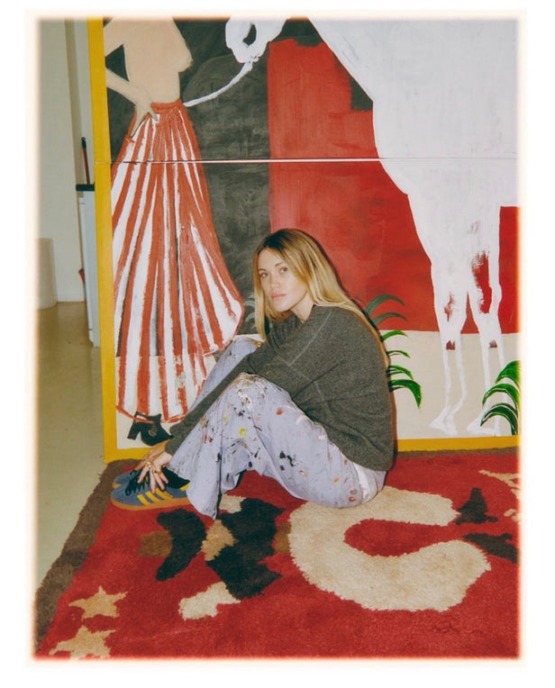 woman with blond hair sitting