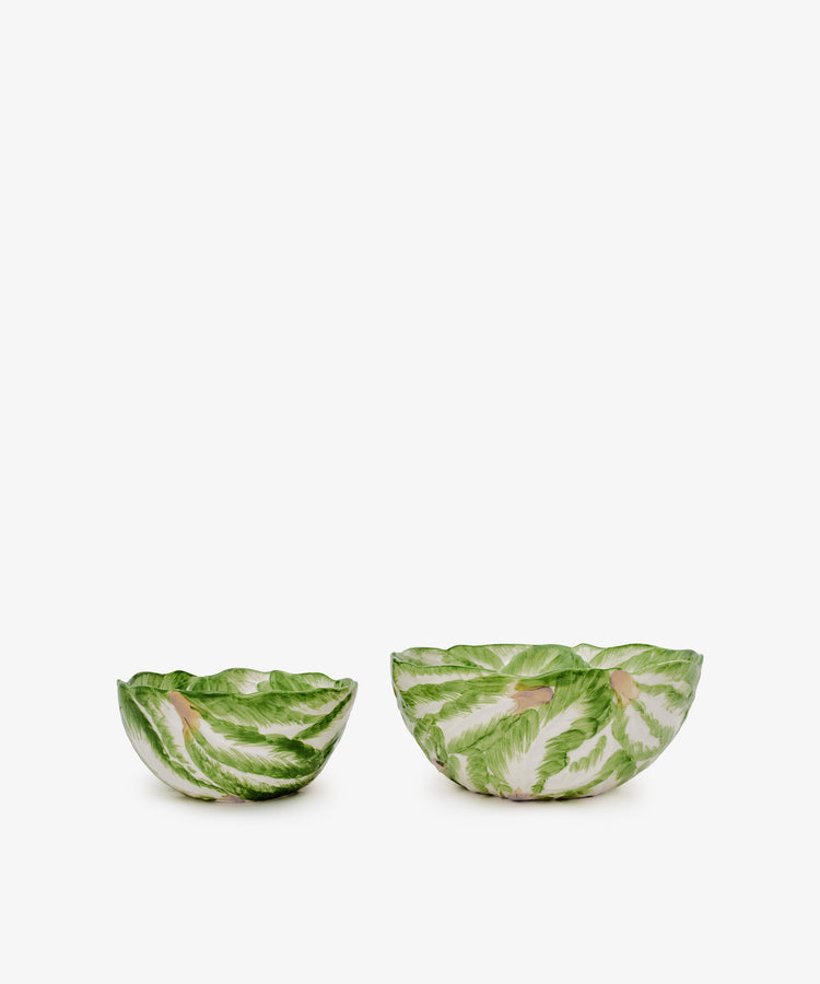 The Nesting Bundle: A set of two ceramic Italian clay bowls with green leaf patterns, one small and one large, displayed side by side on a white background.