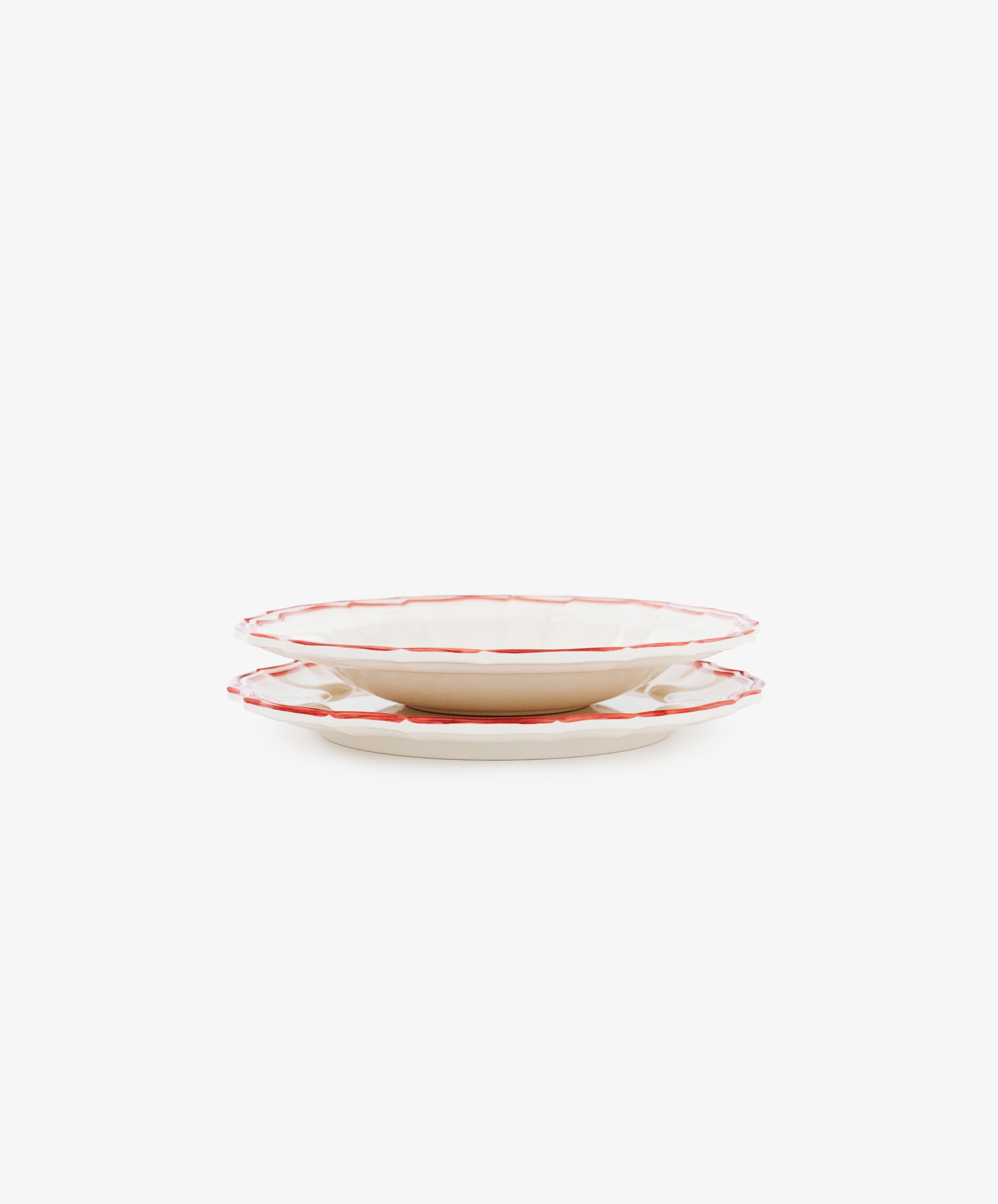 A set of four Eva Melamine Small Plates, BPA-free with a white design and red trim, are displayed stacked against a plain white background.