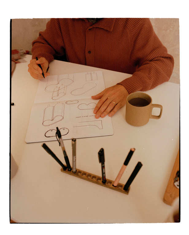 man drawing at the table 