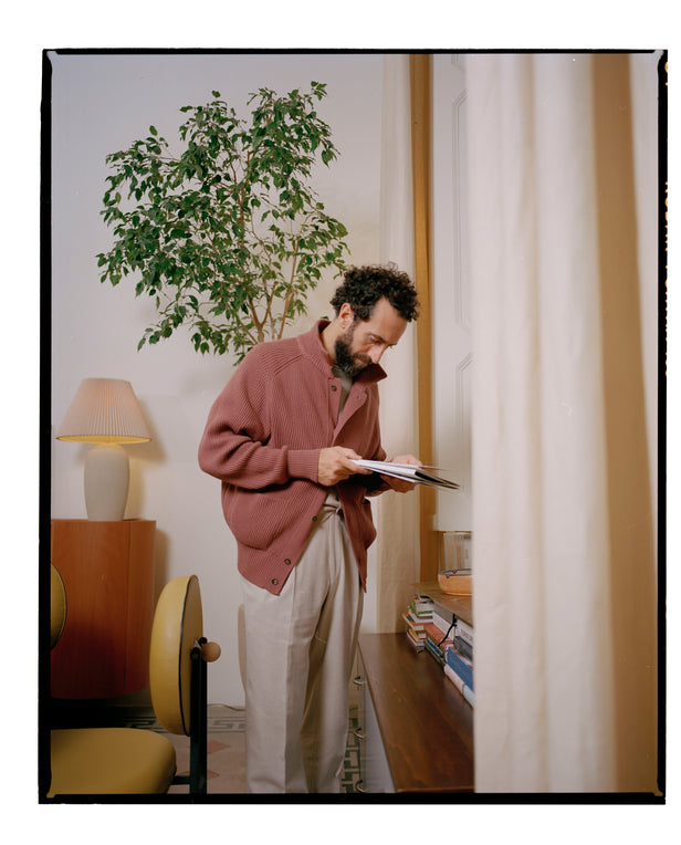 man standing reading