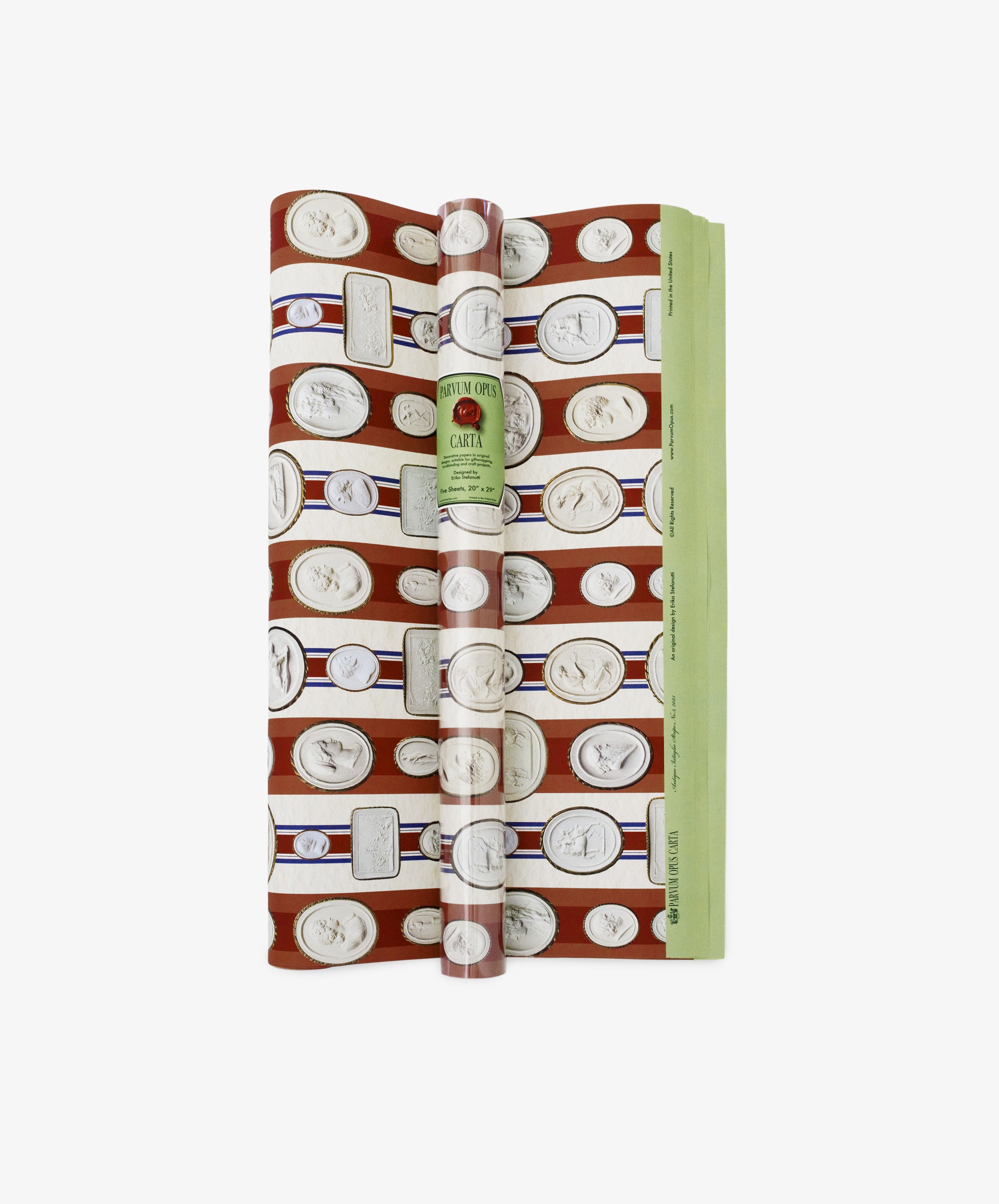 A rolled sheet of Intaglio Stripe Gift Wrap in red and green with a repeating white coin pattern and a vintage-style Parvum Opus label on the front.