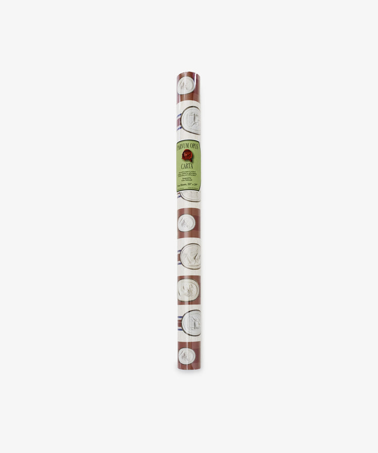 A rolled sheet of Intaglio Stripe Gift Wrap in brown, featuring a repeating pattern of white circles and line drawings, labeled with a green Parvum Opus sticker.