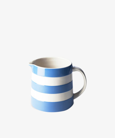 The Betty Medium Dreadnought Jug, featuring a handle and decorated with alternating horizontal blue and white stripes, is shown against a plain white background.