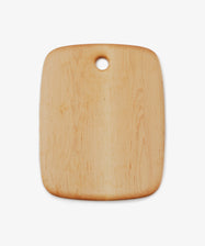 Birds Eye Maple Chopping Board. Rounded edge medium rectangular wooden cutting board with circular hole at top centre.