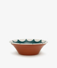 Stella Serving Bowl.  Glazed terracotta bowl with white rim and dark green design, side view.