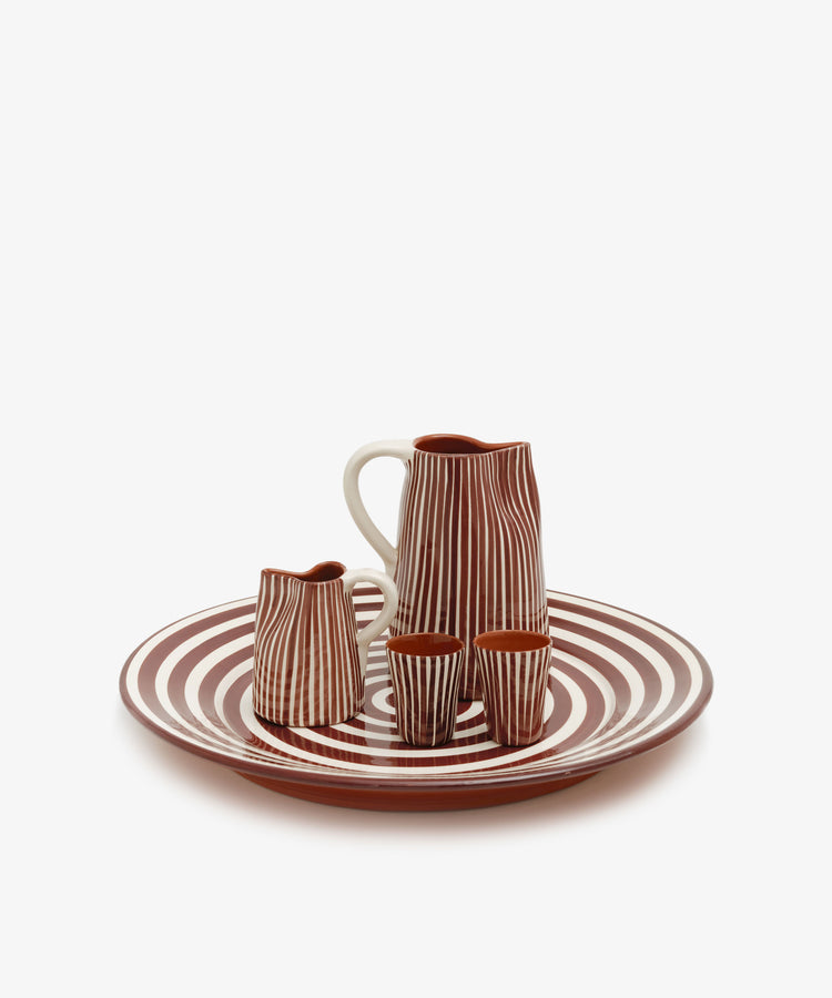Natalia Platter in burgundy and white holds matching tumblers, milk jug and pitcher.
