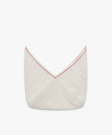 The Filial Bread Bento, Set of 2, features folded white cloths made from 100% linen with red V-shaped stitching along the top edge, shown against a plain white background.