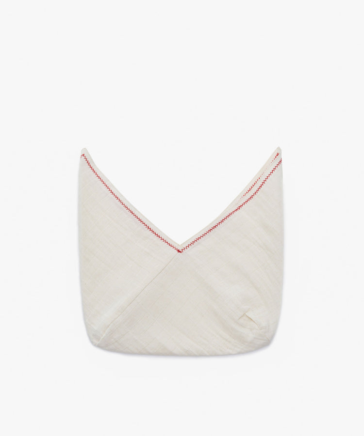 The Filial Bread Bento, Set of 2, features folded white cloths made from 100% linen with red V-shaped stitching along the top edge, shown against a plain white background.