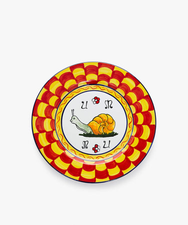 Palio Dinner Plate. Glazed ceramic in red and yellow designs with snail motif.