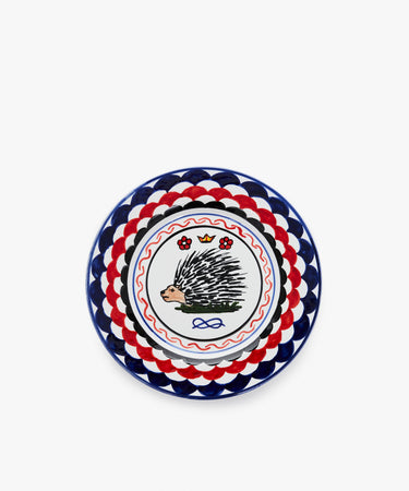 Palio Small Plate in white glazed ceramic with blue and red designs and porcupine motif.
