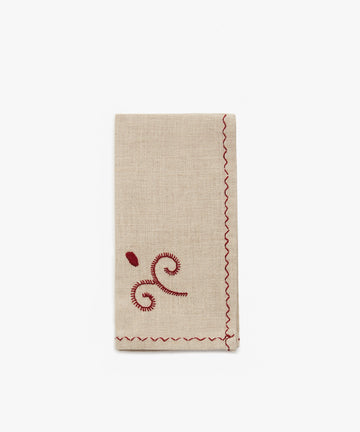 Inez Napkin, single folded napkin in tan cotton with red cotton stitching.
