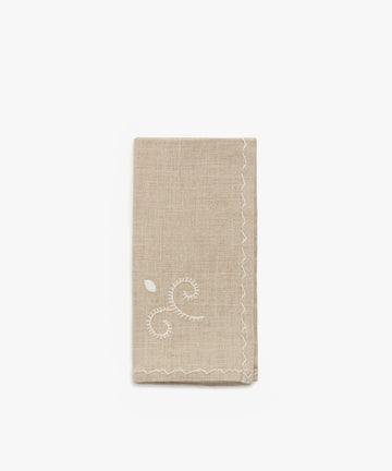 Inez Napkin, single folded napkin in tan cotton with white cotton stitching.