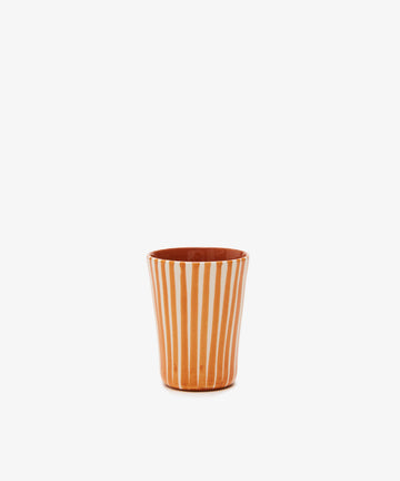Single orange and white striped glazed terracotta tumbler.